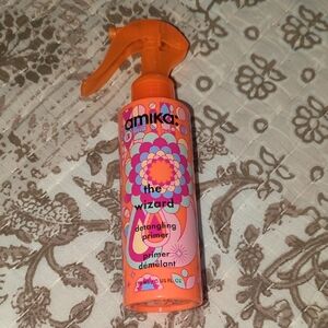 Amika The Wizard Detangling Spray.